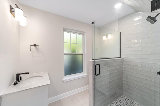 129 SE Watula Ave, Ocala, FL 34471 - bathroom featuring a stall shower, vanity, and baseboards