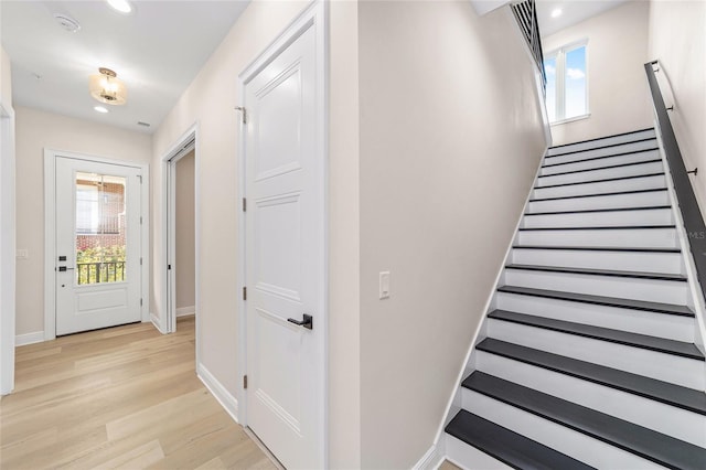 129 SE Watula Ave, Ocala, FL 34471 - stairs featuring baseboards, recessed lighting, and wood finished floors