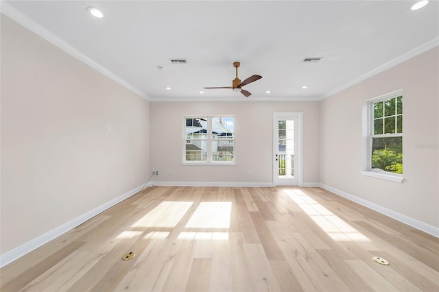 129 SE Watula Ave, Ocala, FL 34471 - empty room with crown molding, a wealth of natural light, a ceiling fan, and baseboards
