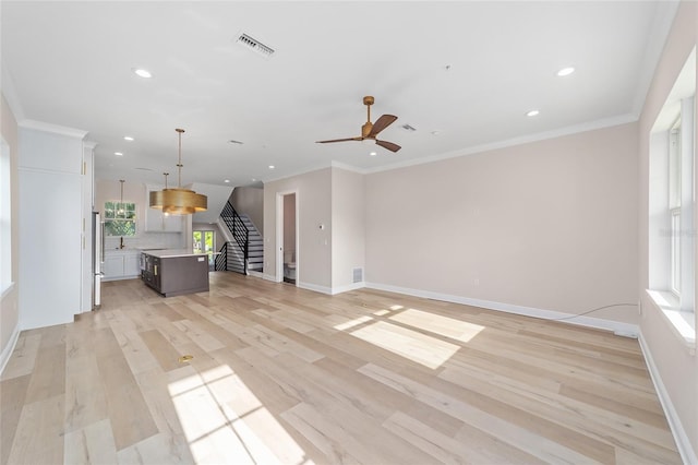 129 SE Watula Ave, Ocala, FL 34471 - unfurnished living room with baseboards, recessed lighting, stairs, visible vents, and ceiling fan