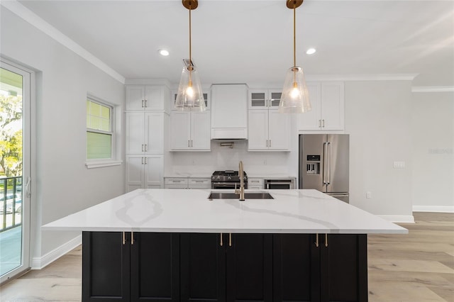 141 SE Watula Ave, Ocala, FL 34471 - kitchen with tasteful backsplash, crown molding, appliances with stainless steel finishes, and a sink