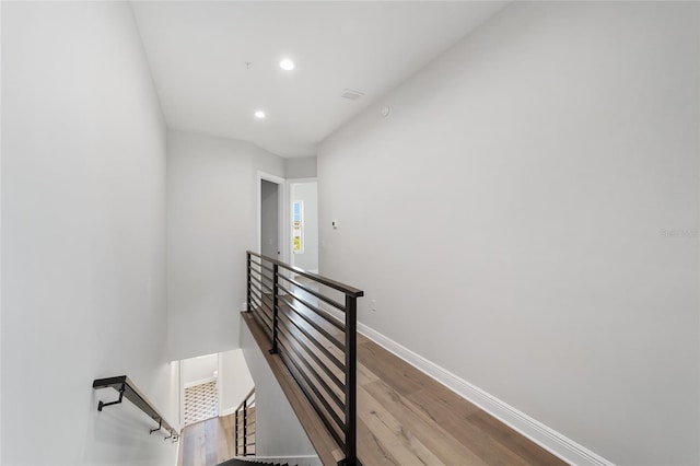 141 SE Watula Ave, Ocala, FL 34471 - staircase with wood finished floors, baseboards, and recessed lighting