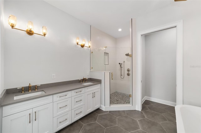 141 SE Watula Ave, Ocala, FL 34471 - bathroom featuring a shower stall, a sink, tile patterned flooring, and baseboards