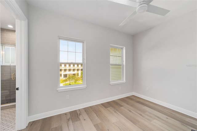 141 SE Watula Ave, Ocala, FL 34471 - spare room featuring wood finished floors, baseboards, a ceiling fan, and plenty of natural light