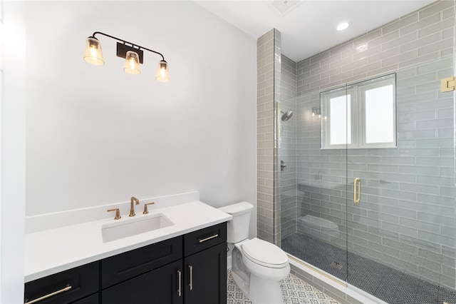 141 SE Watula Ave, Ocala, FL 34471 - bathroom with a shower stall, vanity, recessed lighting, toilet, and tile patterned floors