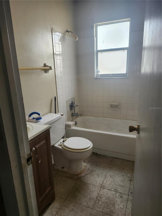bathroom featuring vanity, toilet, and bathing tub / shower combination