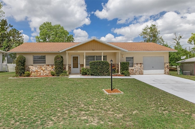 3288 N Maidencane Dr, Beverly Hills, FL 34465 - ranch-style home with a front yard, an attached garage, stone siding, and concrete driveway