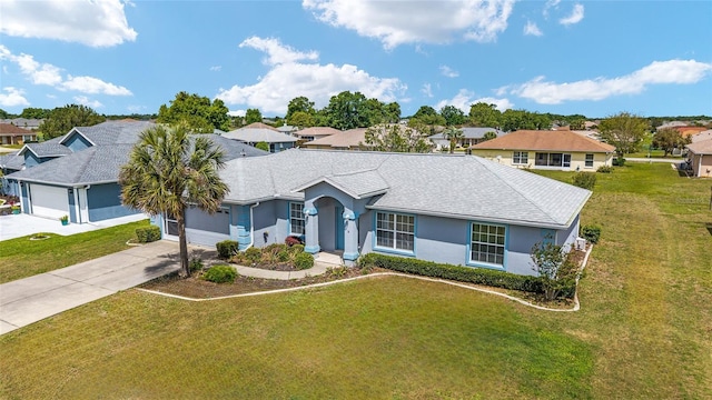 single story home featuring driveway, stucco siding, an attached garage, a front lawn, and a residential view