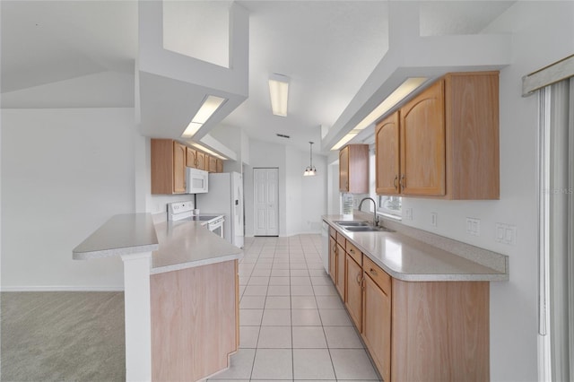 kitchen featuring light countertops, a peninsula, white appliances, a sink, and vaulted ceiling
