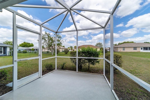 unfurnished sunroom featuring a residential view
