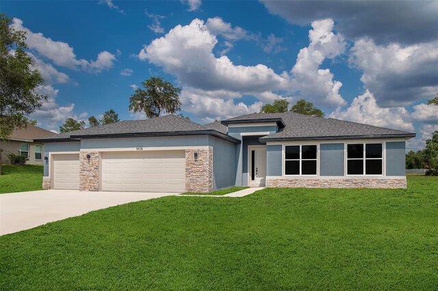 9552 SW 40th Ter, Ocala, FL 34476 - prairie-style house featuring stone siding, an attached garage, stucco siding, and a front lawn