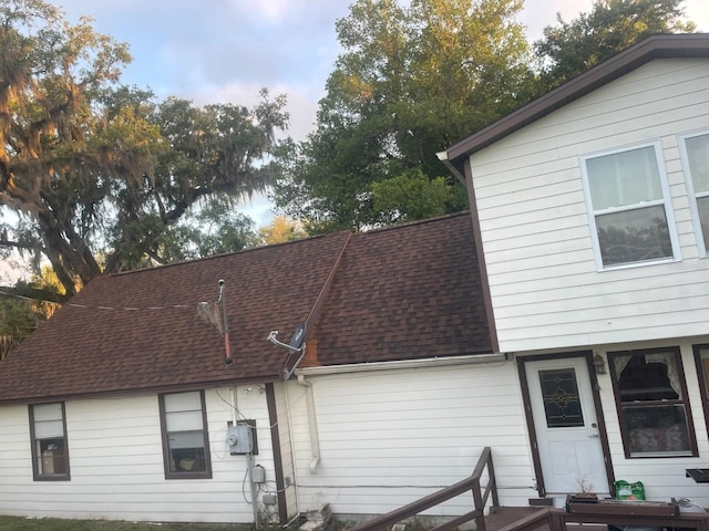 14953 SE 107th Ave, Summerfield, FL 34491 - back of house featuring roof with shingles