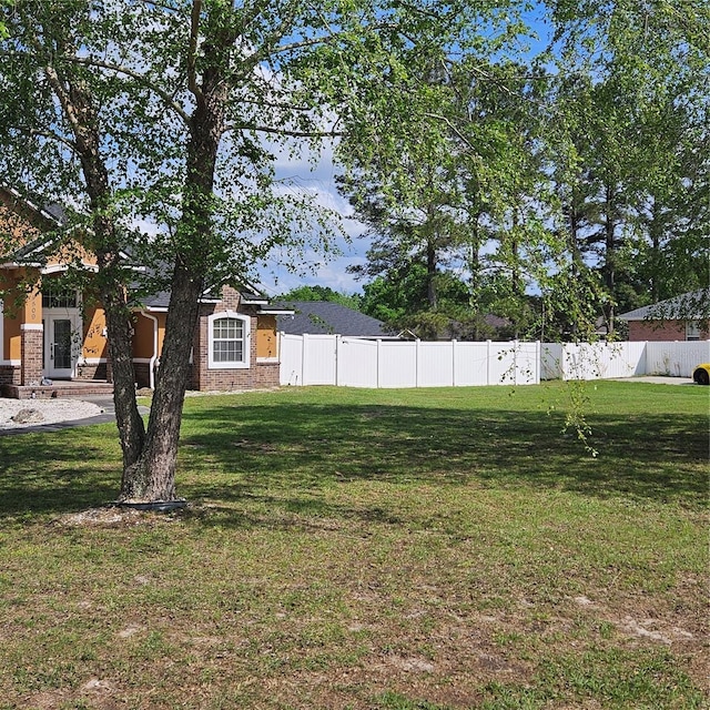 view of yard featuring fence