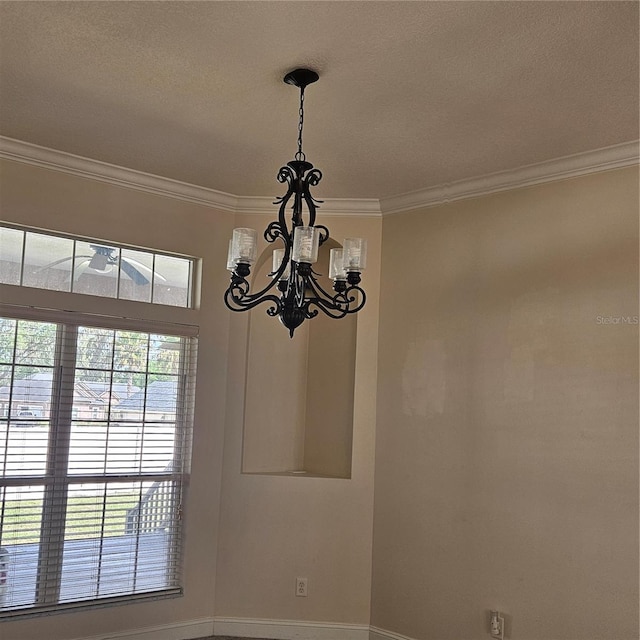 room details with an inviting chandelier and crown molding