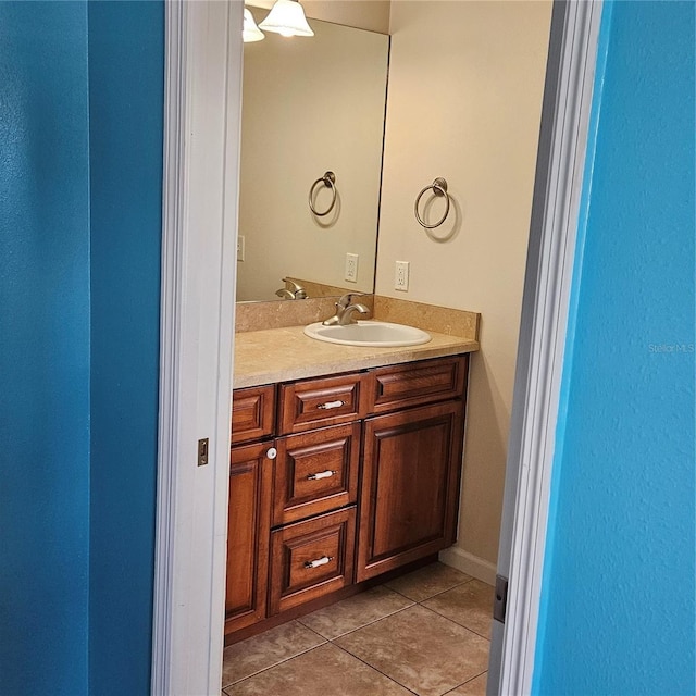 bathroom with tile patterned flooring and vanity