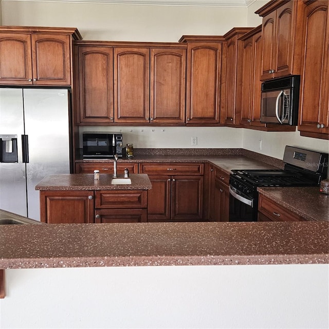 kitchen with dark stone countertops and appliances with stainless steel finishes
