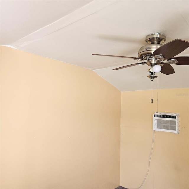 interior details featuring a wall unit AC and a ceiling fan
