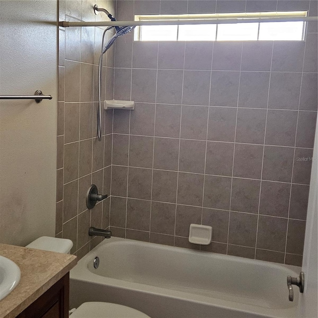 full bath with toilet, vanity, and shower / bath combination