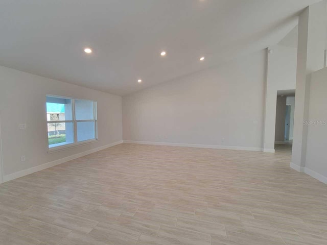 9553 SW 42nd Ave, Ocala, FL 34476 - unfurnished room featuring light wood-style flooring, baseboards, recessed lighting, and vaulted ceiling