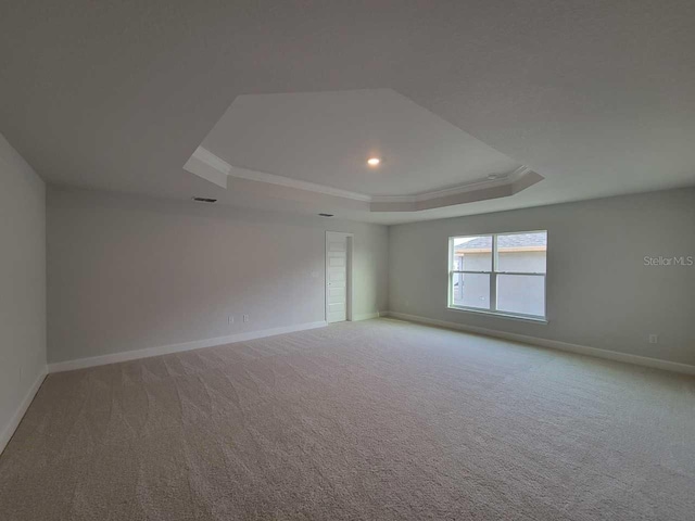 9553 SW 42nd Ave, Ocala, FL 34476 - carpeted spare room with a raised ceiling, baseboards, crown molding, and recessed lighting