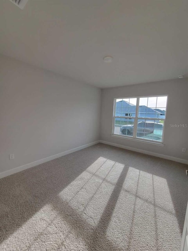 9553 SW 42nd Ave, Ocala, FL 34476 - unfurnished room featuring baseboards and carpet floors