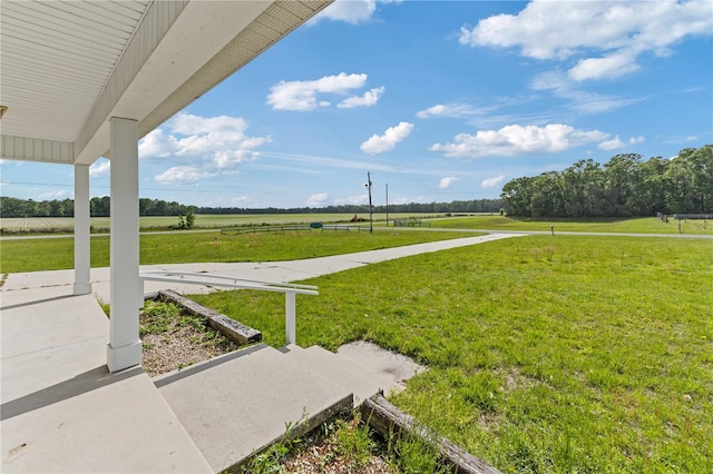 view of yard with a rural view