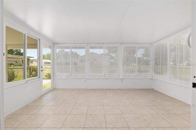unfurnished sunroom with tile patterned floors