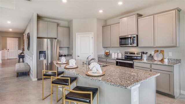 12833 NW 13th Ln, Newberry, FL 32669 - kitchen with a sink, appliances with stainless steel finishes, and gray cabinetry