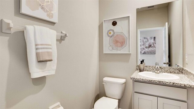 12833 NW 13th Ln, Newberry, FL 32669 - bathroom featuring toilet and vanity