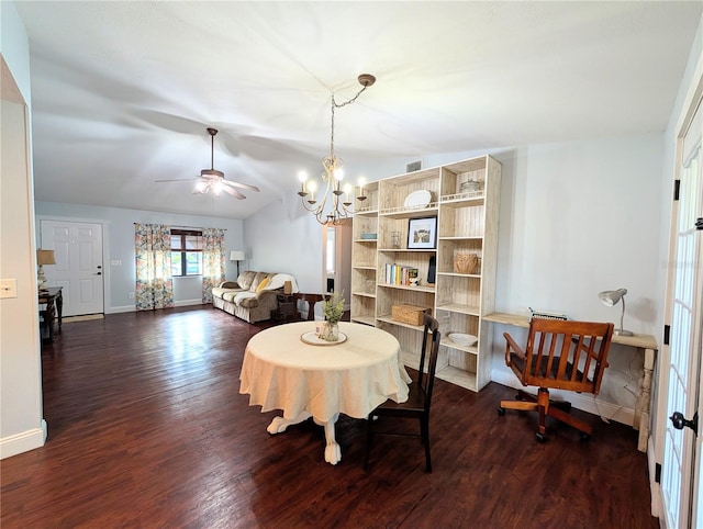 dining area with vaulted ceiling, baseboards, dark wood-style flooring, and ceiling fan with notable chandelier