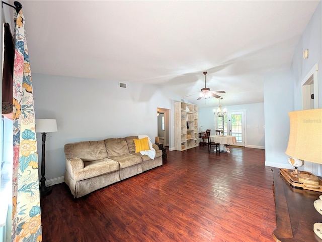 living room with baseboards, wood finished floors, visible vents, and ceiling fan