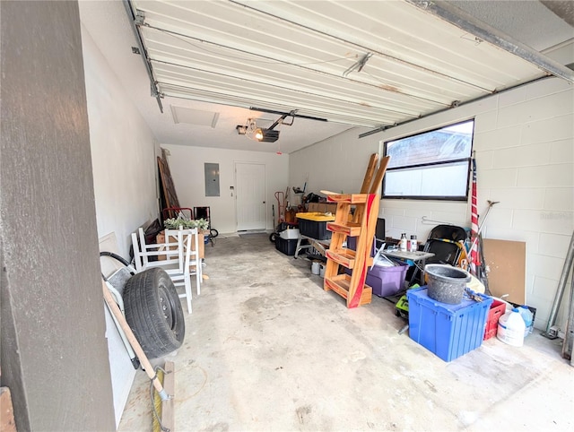 garage featuring electric panel and a garage door opener