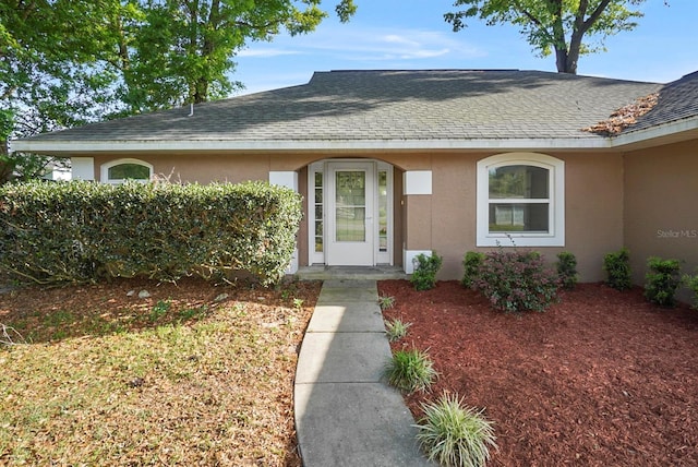 4246 NE 32nd Cir, Ocala, FL 34479 - entrance to property with roof with shingles and stucco siding