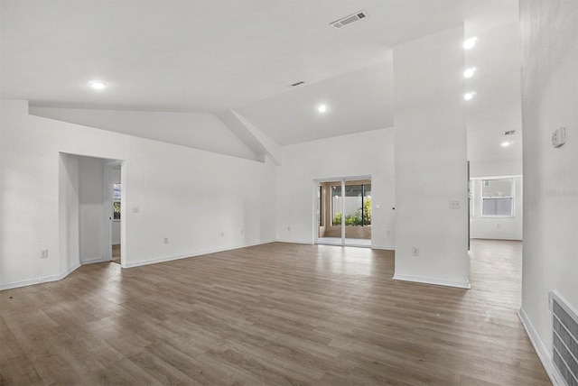 4246 NE 32nd Cir, Ocala, FL 34479 - unfurnished room featuring wood finished floors, high vaulted ceiling, baseboards, and visible vents