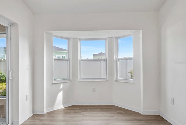 4246 NE 32nd Cir, Ocala, FL 34479 - empty room with light wood-style flooring and baseboards