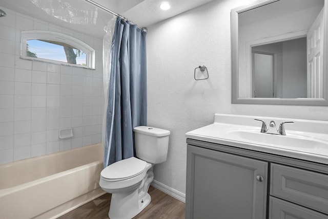 4246 NE 32nd Cir, Ocala, FL 34479 - bathroom with shower / bathtub combination with curtain, vanity, toilet, wood finished floors, and baseboards