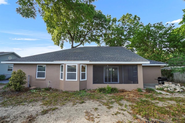 4246 NE 32nd Cir, Ocala, FL 34479 - view of front of house with roof with shingles, a patio area, stucco siding, and fence