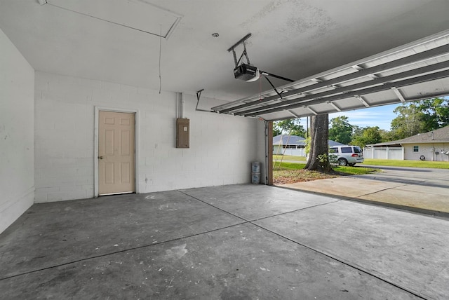 4246 NE 32nd Cir, Ocala, FL 34479 - garage with a garage door opener and electric panel