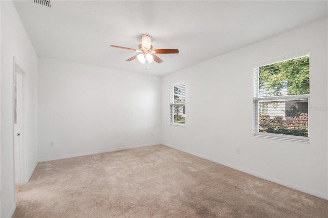 8546 SW 79th Ave, Ocala, FL 34476 - empty room with healthy amount of natural light, light carpet, and ceiling fan