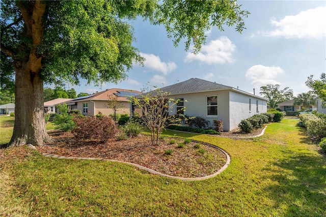 8546 SW 79th Ave, Ocala, FL 34476 - view of front of home with stucco siding and a front yard