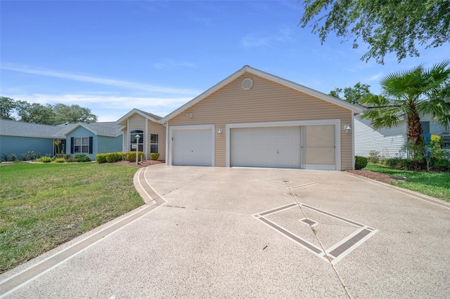 ranch-style home featuring concrete driveway, a front lawn, and an attached garage