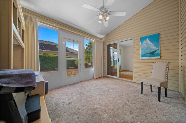 interior space with ceiling fan