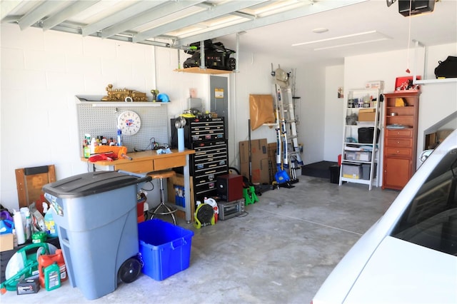 garage featuring a workshop area and a garage door opener