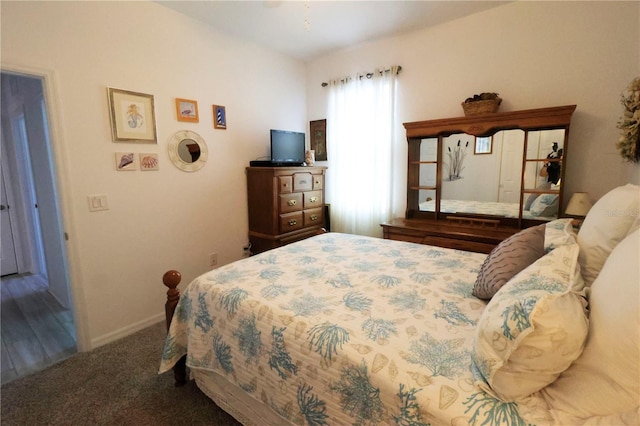 carpeted bedroom with baseboards