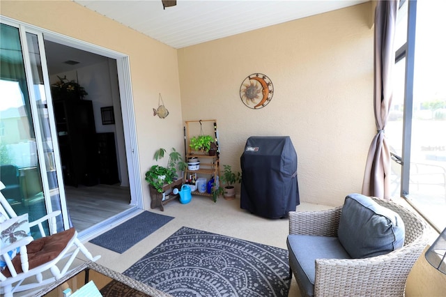 exterior space featuring carpet floors