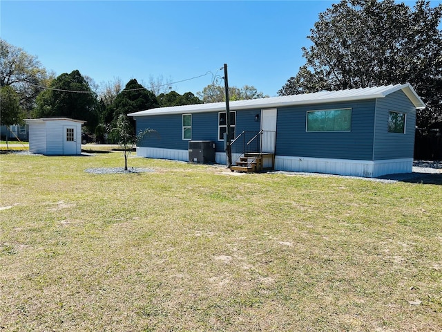 9247 SE 142nd Pl, Summerfield, FL 34491 - exterior space featuring cooling unit, an outbuilding, a shed, and a front yard