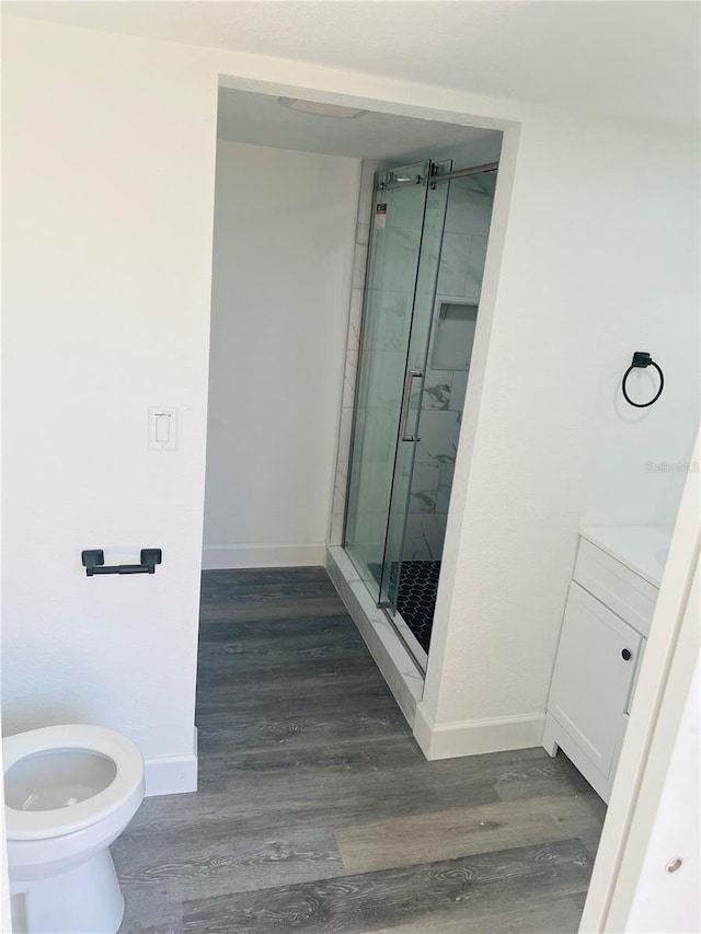 9247 SE 142nd Pl, Summerfield, FL 34491 - bathroom featuring a shower stall, vanity, baseboards, and wood finished floors