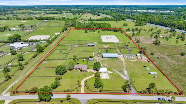 birds eye view of property with a rural view