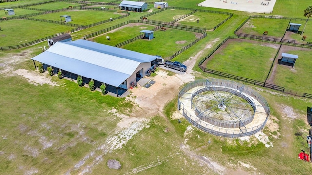 birds eye view of property with a rural view