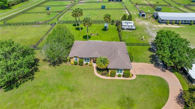 birds eye view of property with a rural view
